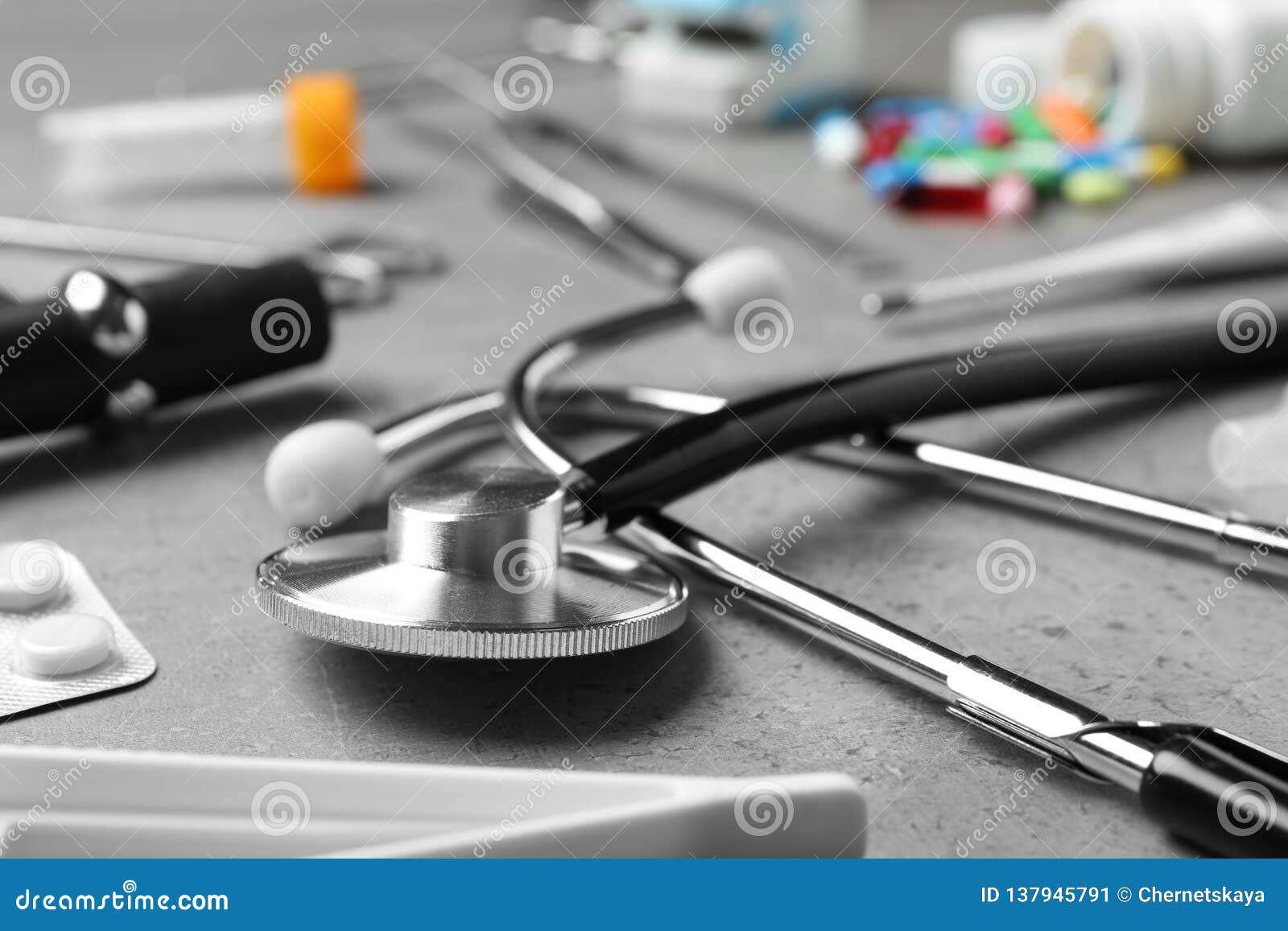 Stethoscope and Different Medical Objects on Grey Table Stock Image