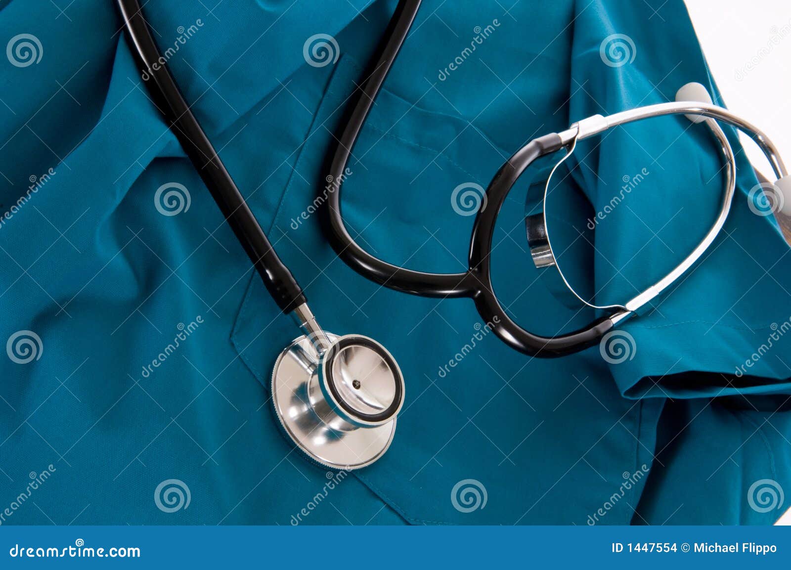 stethoscope and scrubs on white background