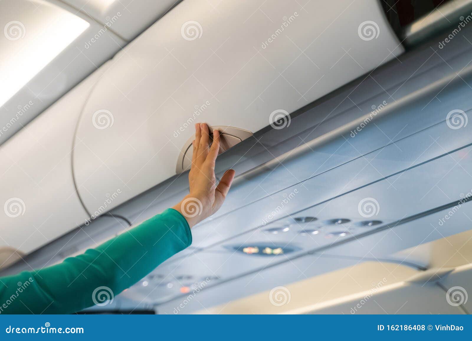 Stewardess Checking Luggage Cabin in Airplane Stock Photo Image of