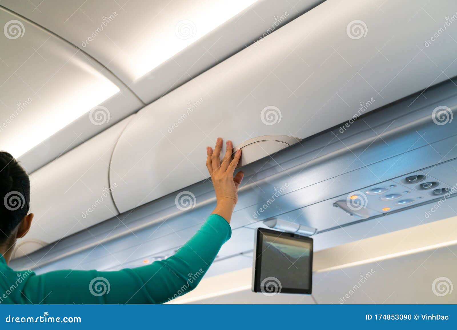 Stewardess Checking Luggage Cabin in Airplane Stock Photo Image of