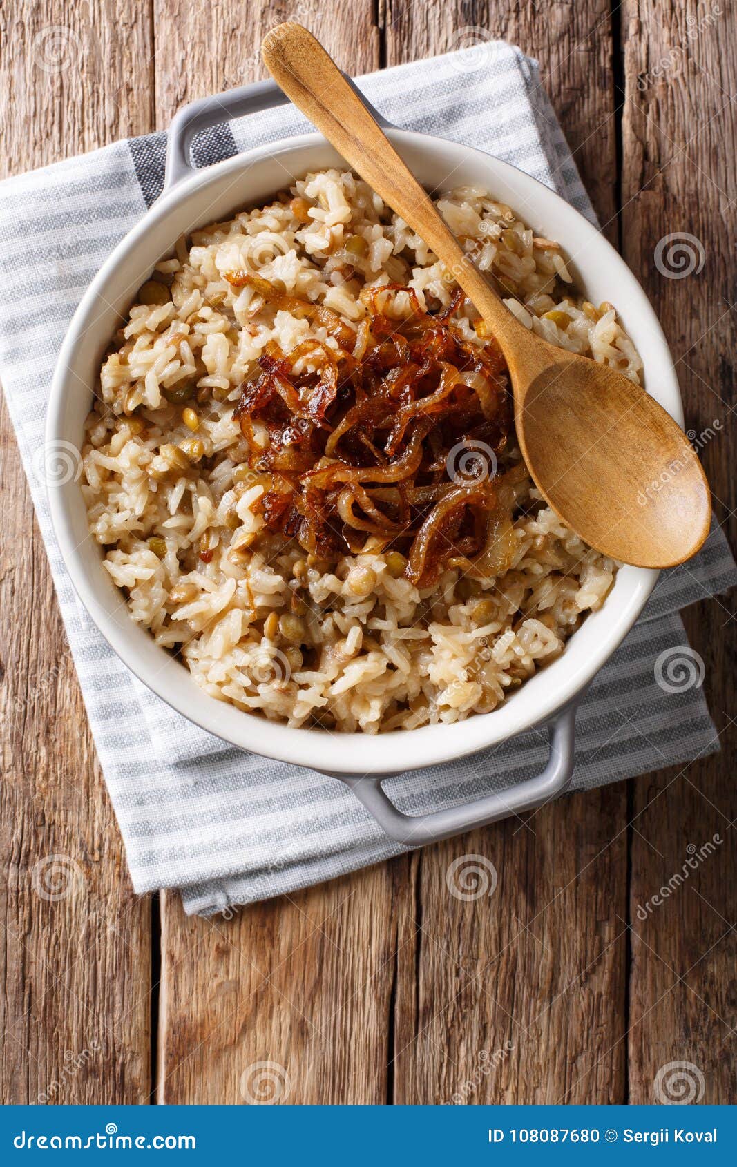 Stewed Rice with Lentils and Fried Onions Close-up in a Bowl. Vertical ...
