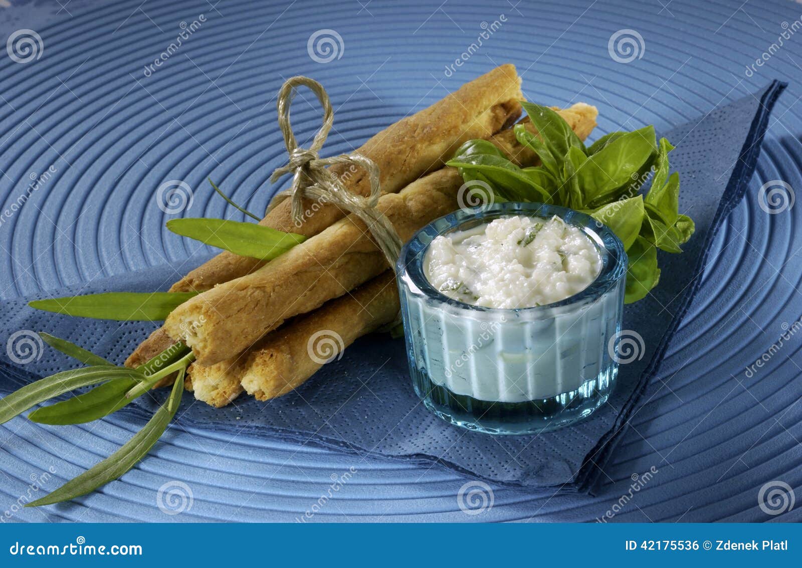 Sticks with Feta Cheese, Tied with String, Blue Background, White Dip, Herbs Stock Photo Image