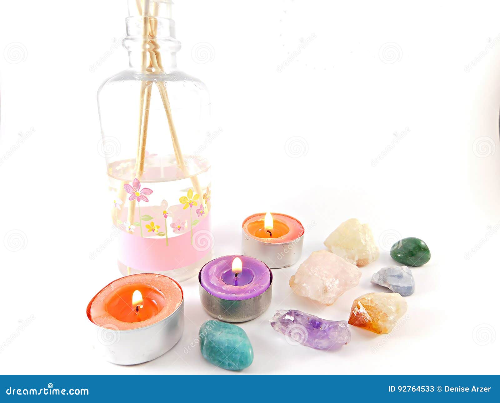 still life of aromatic candles and precious stones.
