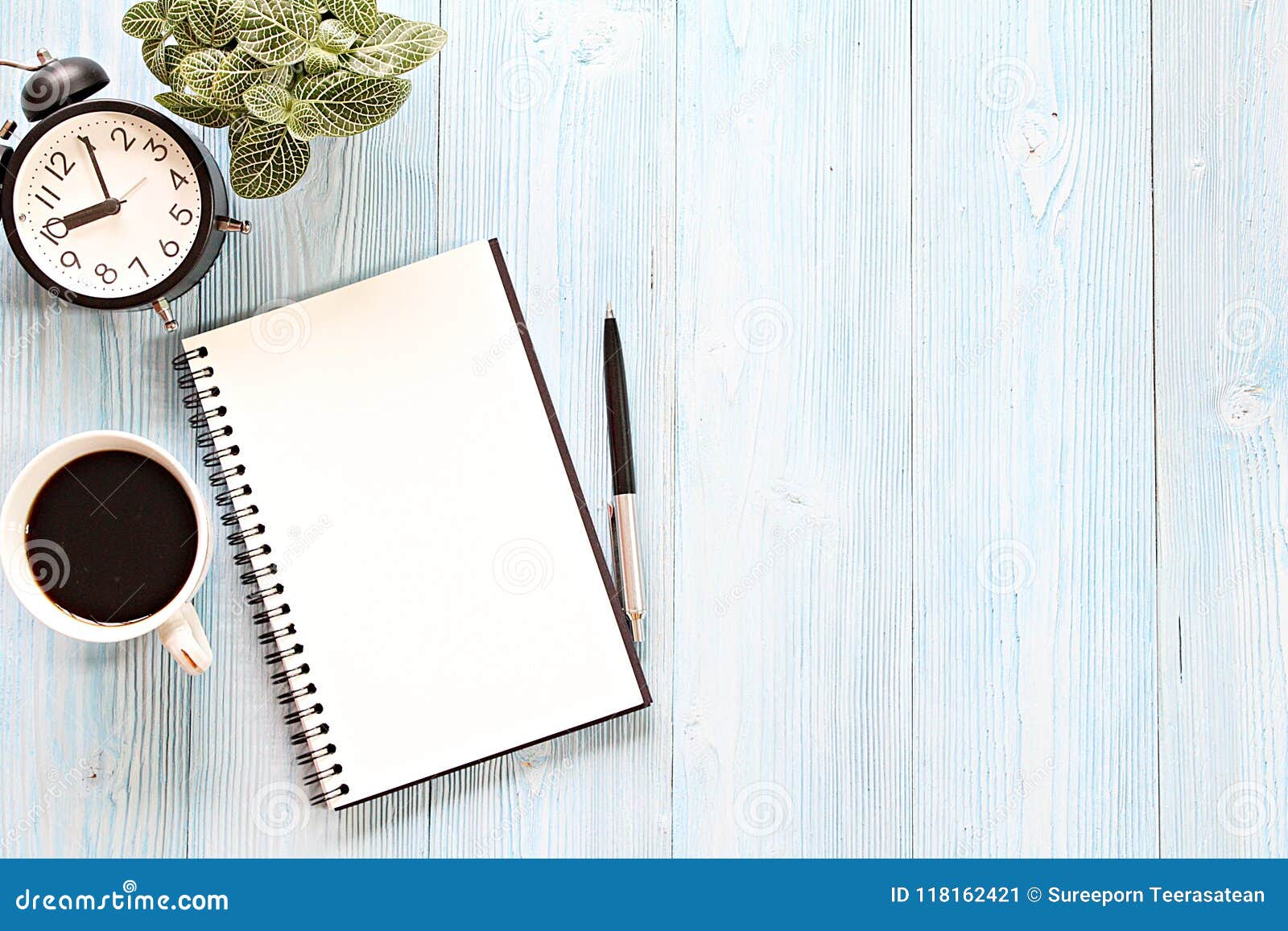 Open Notebook With Blank Pages Coffee Cup And Clock On Wooden