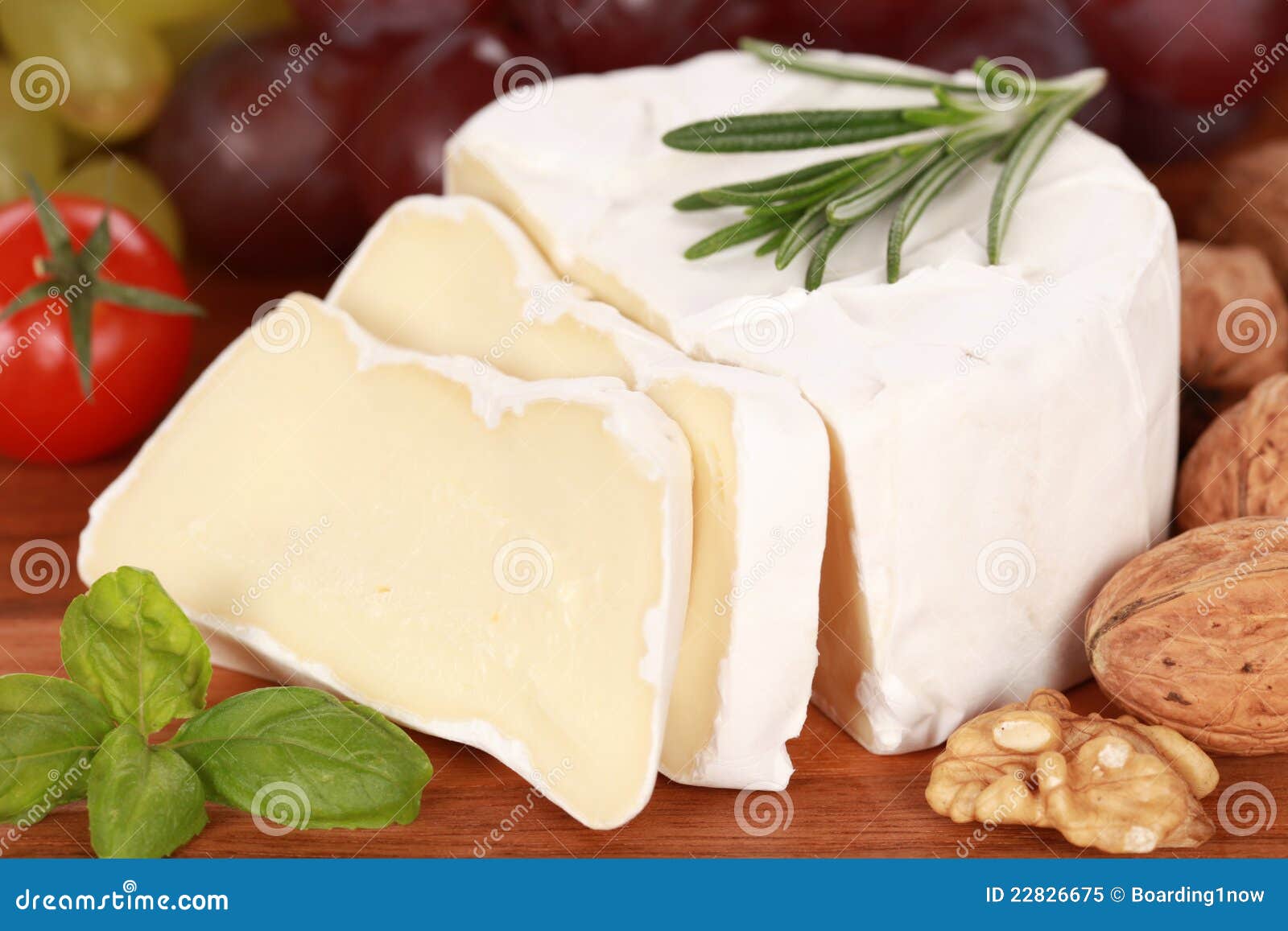 still life with camembert cheese cut on slices