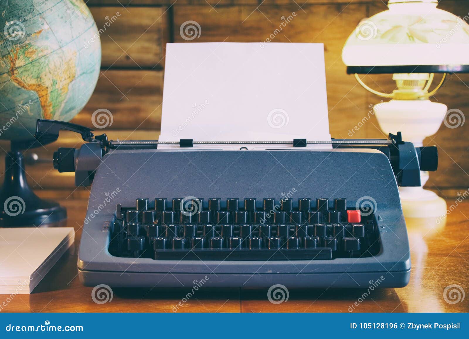 Still Life Of Old Typewriter With Empty Sheet Globe And Old