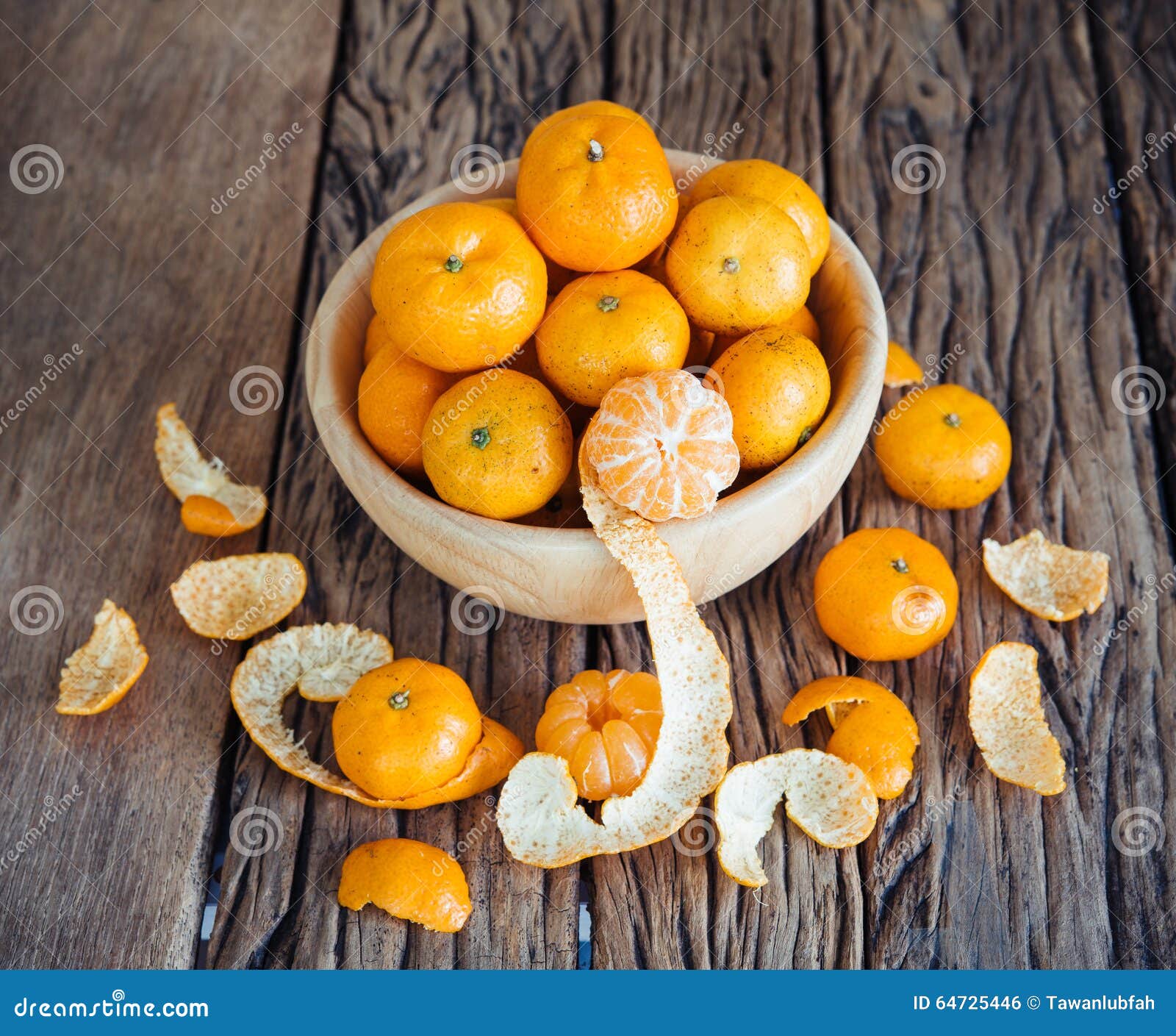 Still Life of Orange Fruit in Bowl on Old Wood Background. Stock Photo