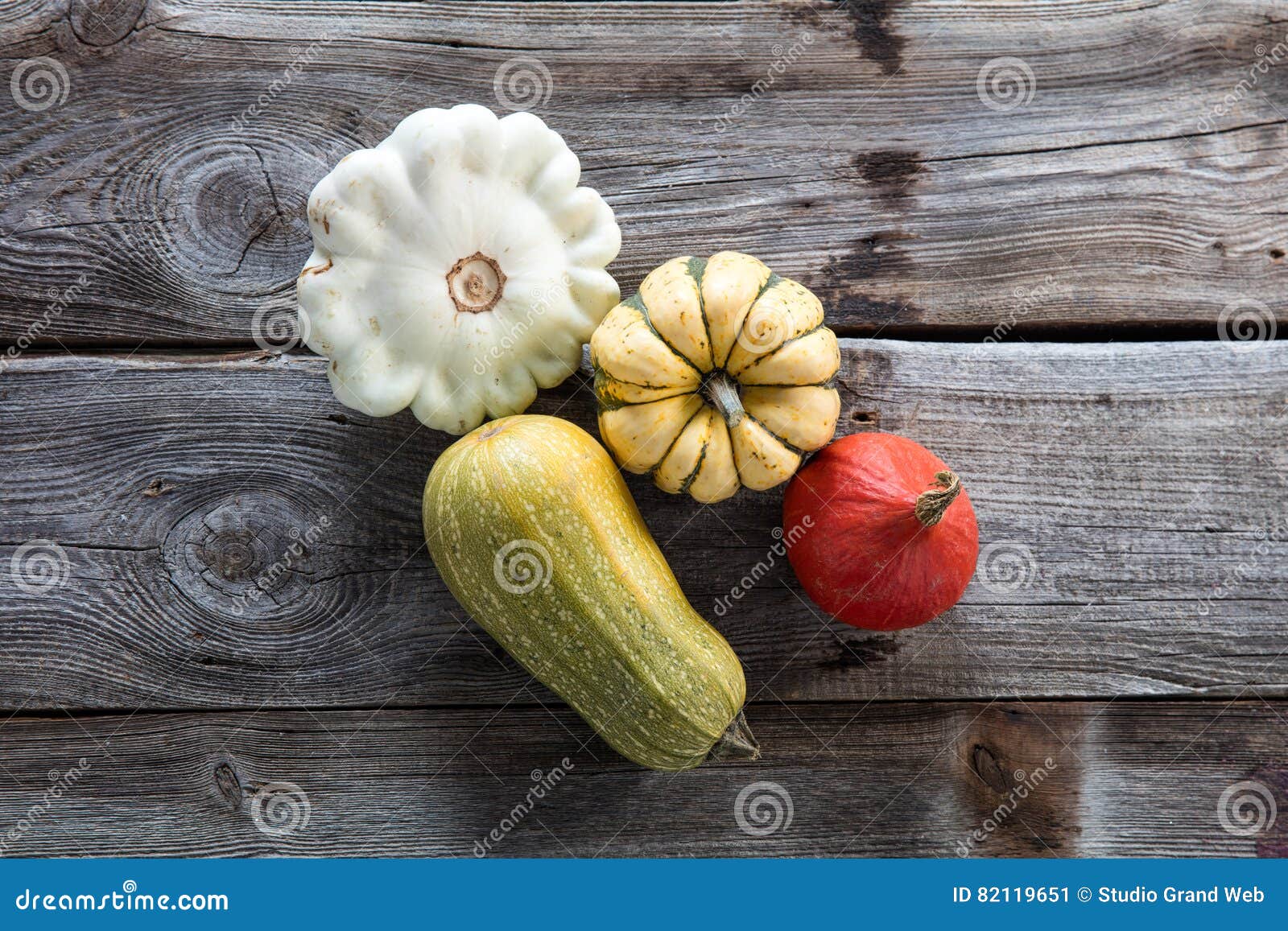 still life of organic cucurbitaceae, kuri squash and green gourd