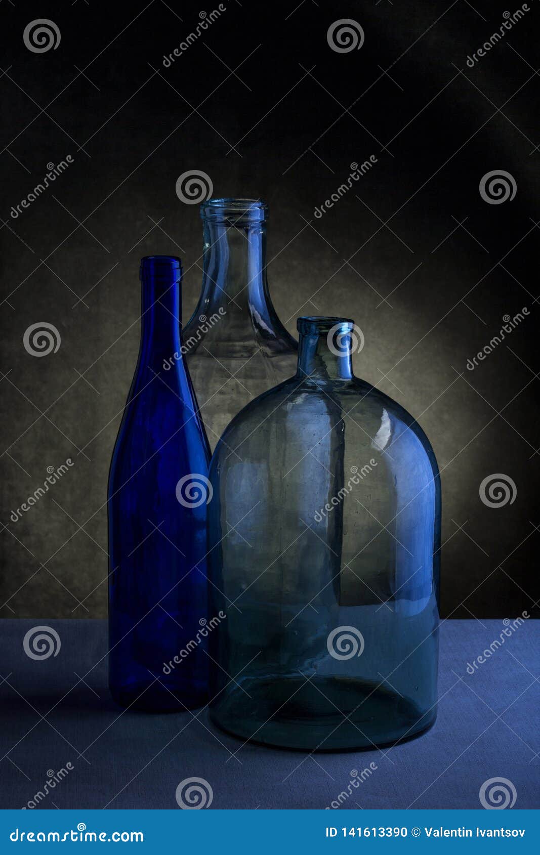 Still Life with Three Glass Bottles Stock Photo Image of light, table 141613390