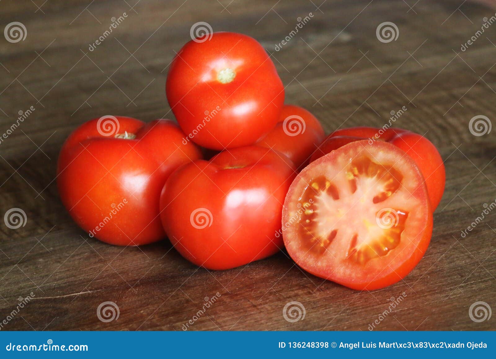 still life of tomatoes on a table.