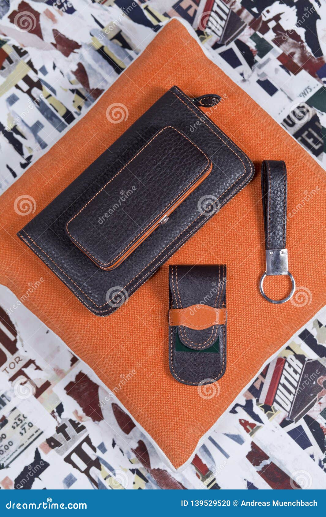 stillife of handmade leather set for men including wallet keyring and manicure