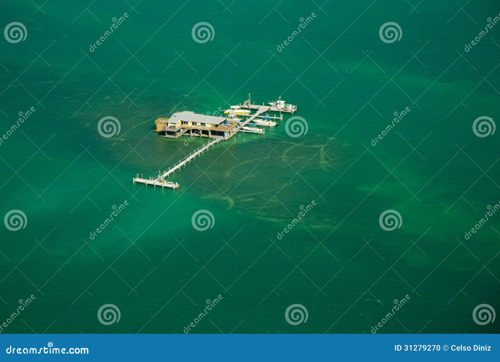 stilt house and pier in the ocean