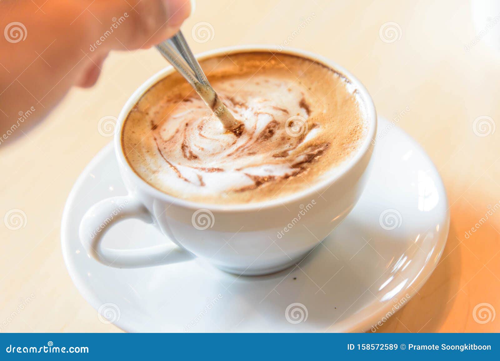 Stir the coffee in cup stock image. Image of hand, drink 158572589