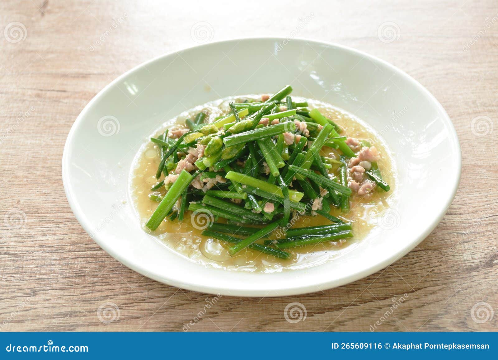 Stir Fried Slice Garlic Chives with Chop Pork on Plate Stock Photo