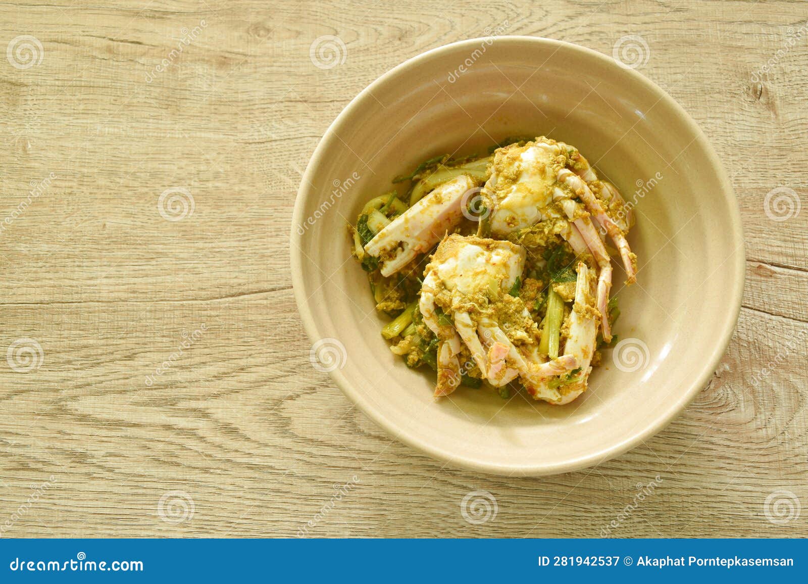 Stir Fried Swimmer Crab in Yellow Curry and Egg on Bowl Stock Image