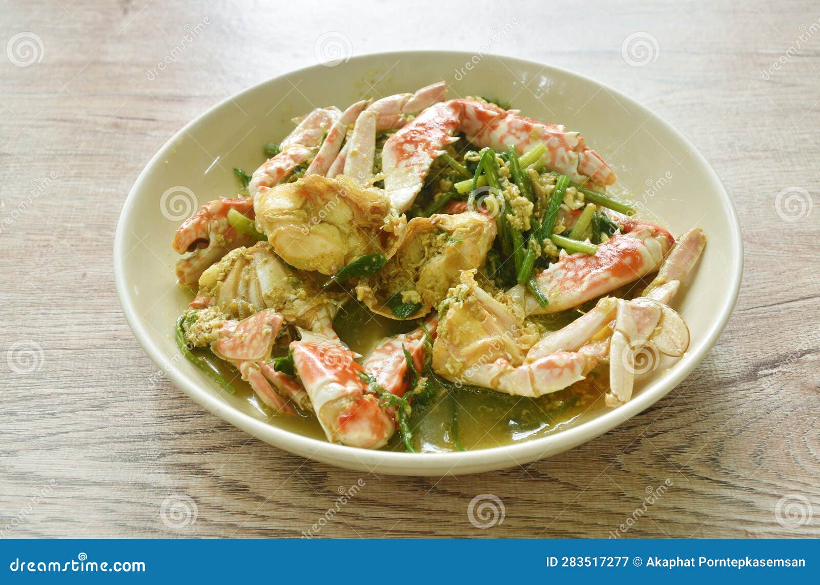Stir Fried Swimmer Crab in Yellow Curry and Egg on Plate Stock Image
