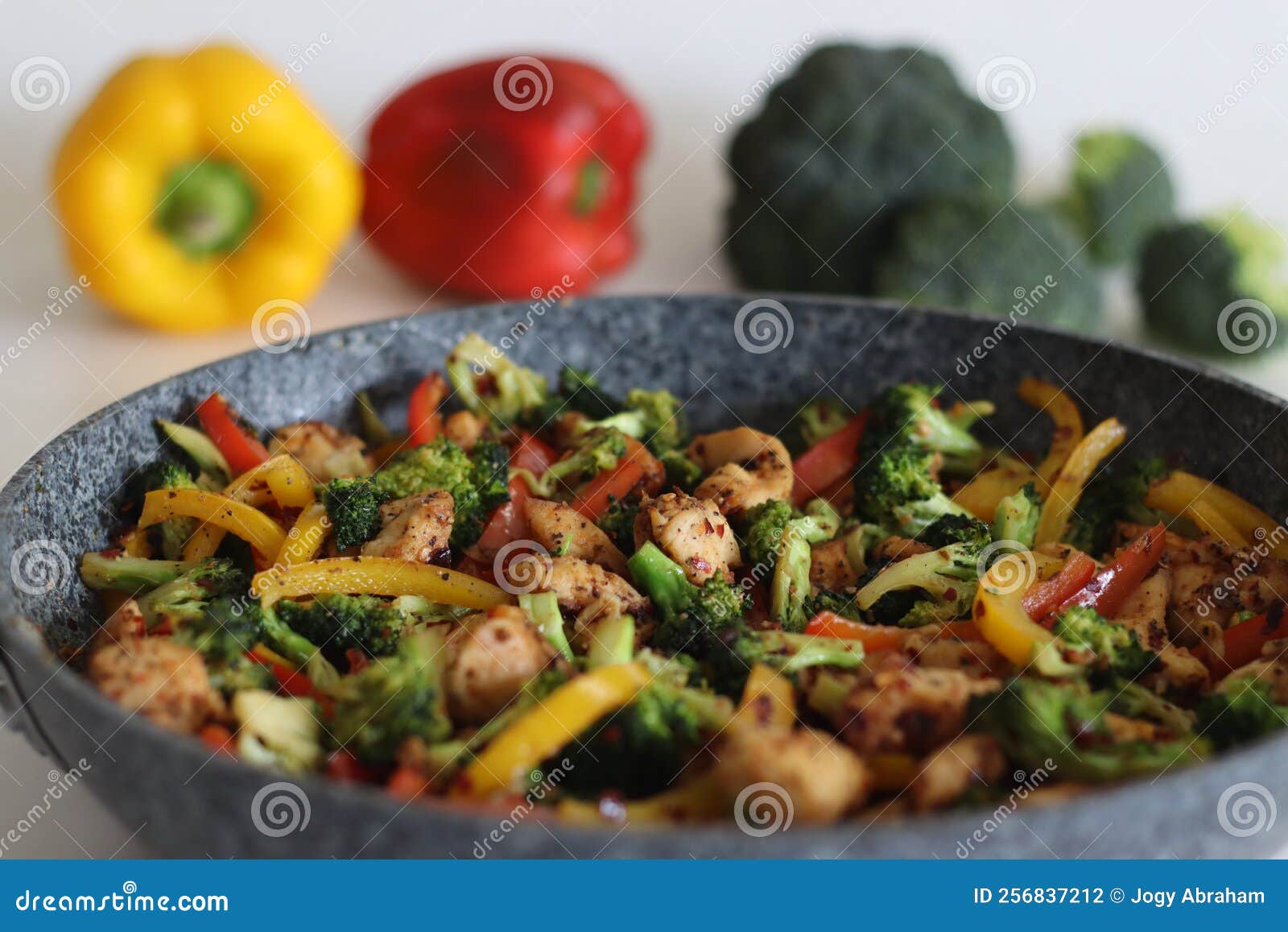 Stir Fried Vegetables with Chicken in Frying Pan. Air Fried Chicken Cubes Tossed with Sauteed
