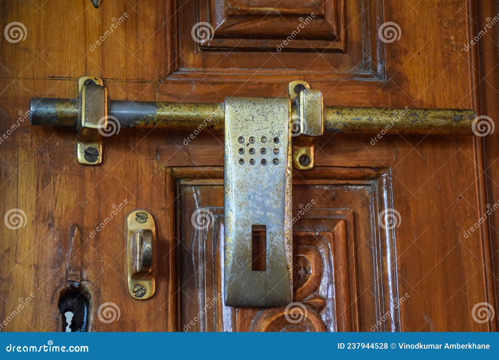 Stock Photo of Antique Indian Style Bronze Metal Door Lock on Wooden ...