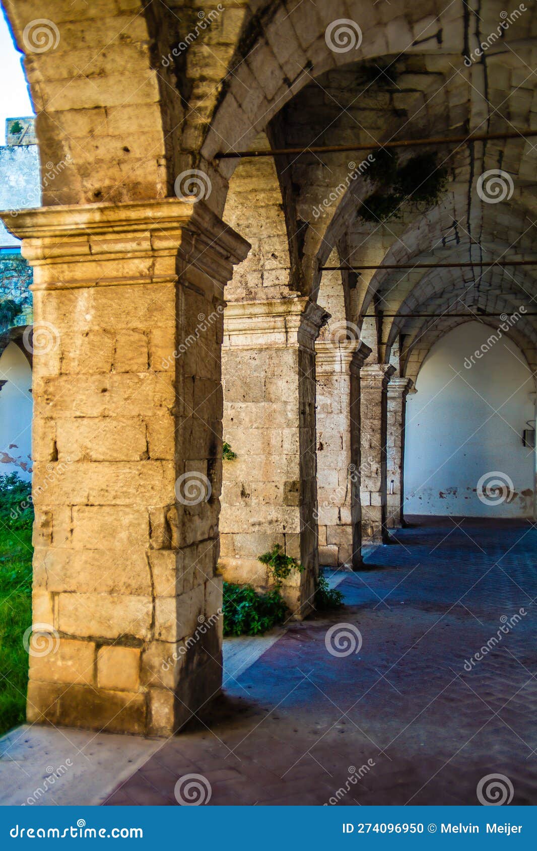 gothic gallery with arches and ancient stones in southern italy