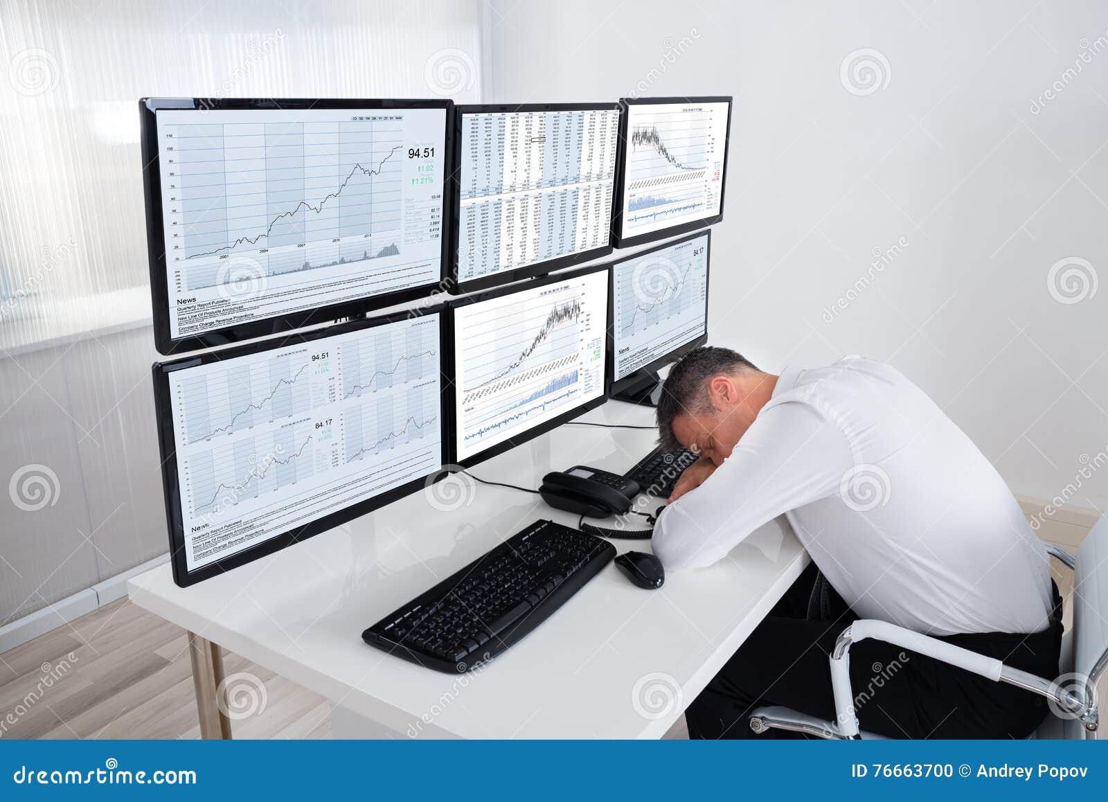 Stock Trader Sleeping At Multiple Computer S Desk Stock Photo