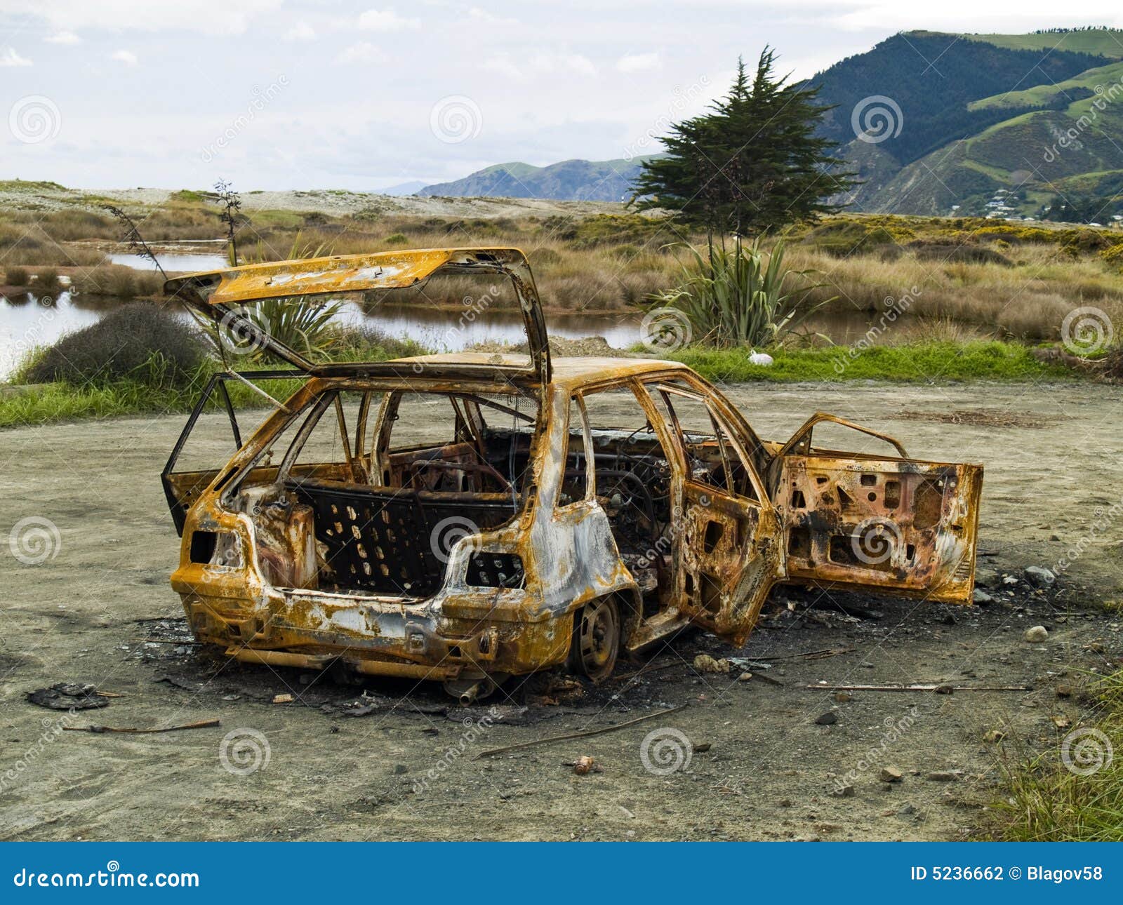 stolen burnt-out rusty car