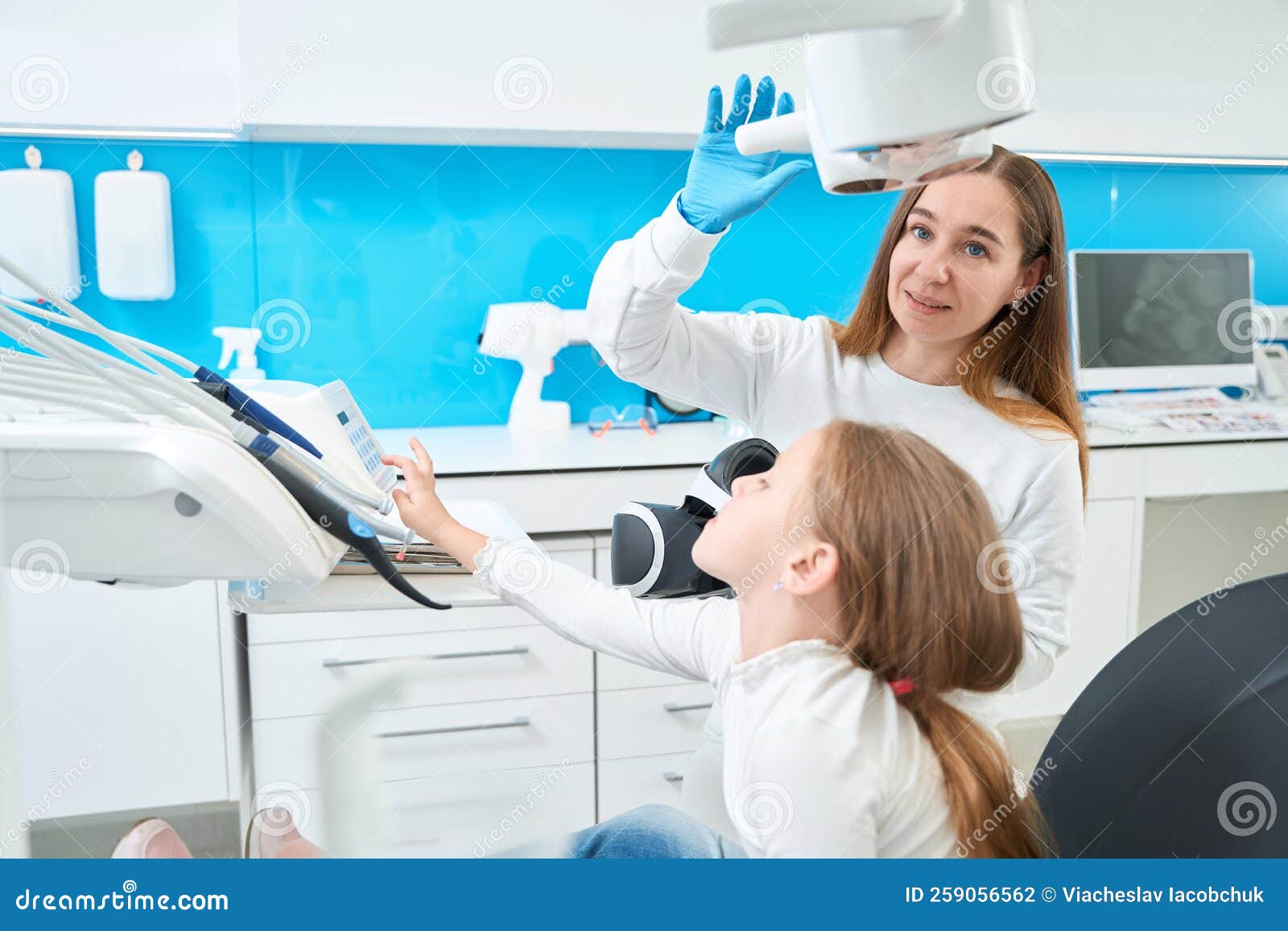 Pediatric Dentist Preparing To Examine Little Patient Teeth Stock Photo