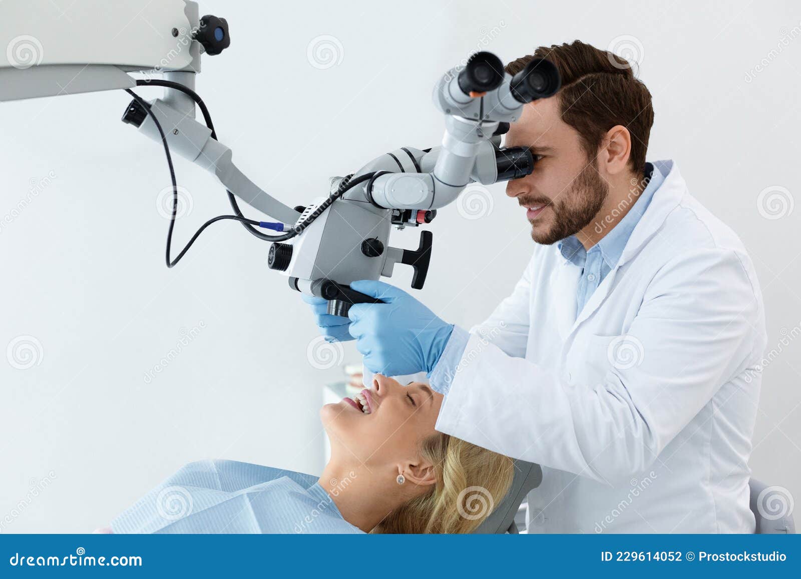 Stomatologist Looking at Dental Microscope, Using Innovative Tools