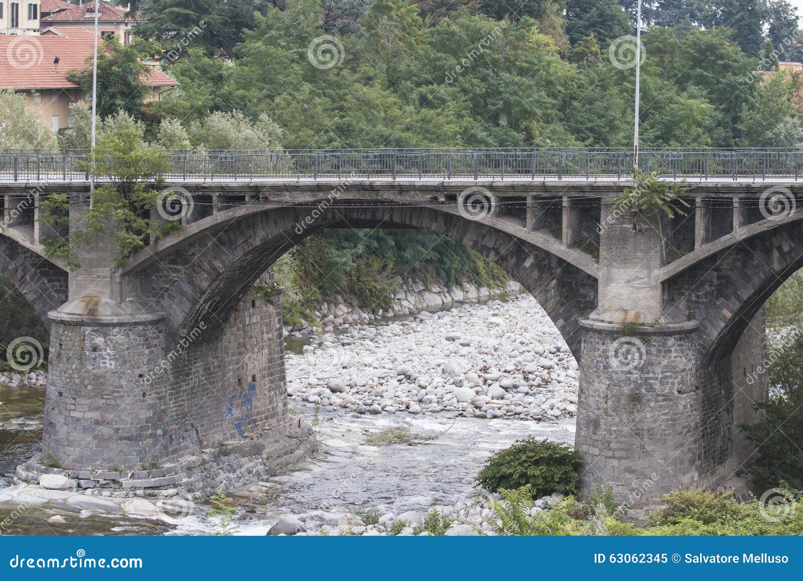 Stone bridge over a river stock image. Image of water ...
