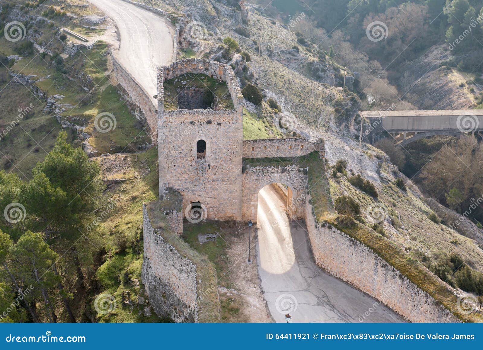 stone-built, gated entrance in the historic city walls of alarcon, spain