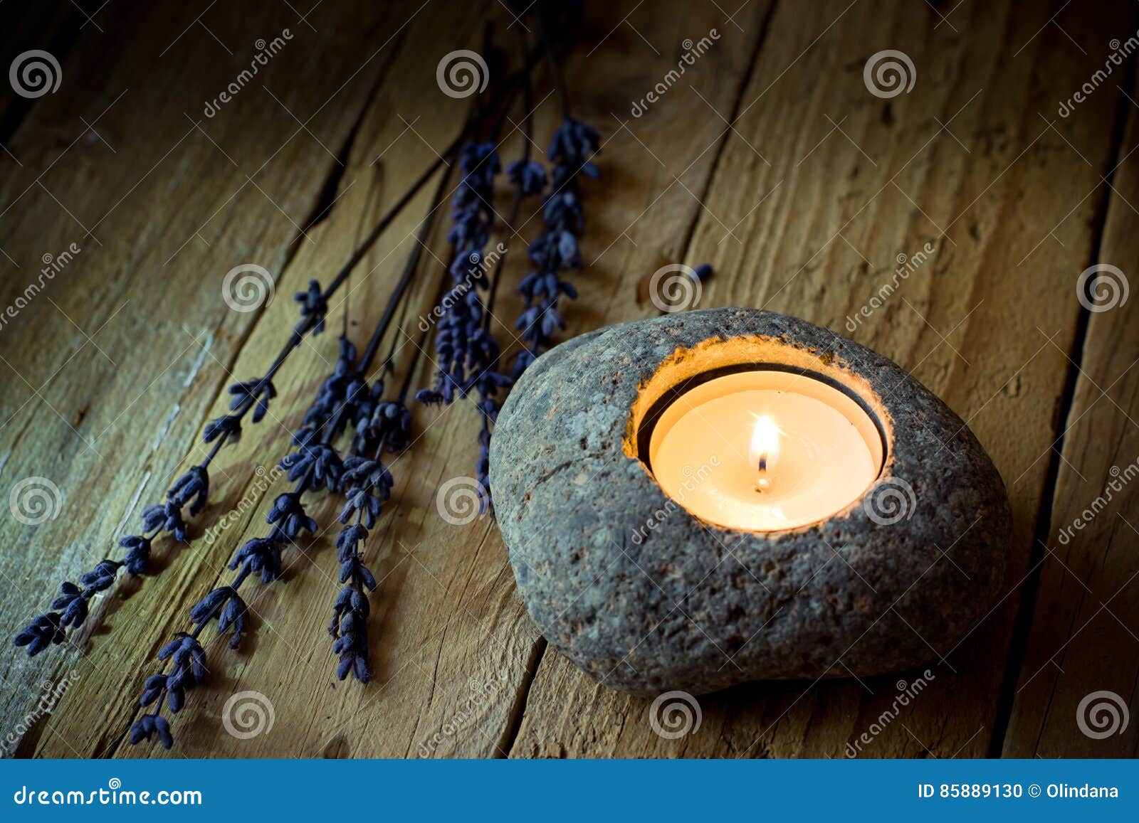 stone candle holder with tea light on barn wood, lavender twigs, easter, tranquility