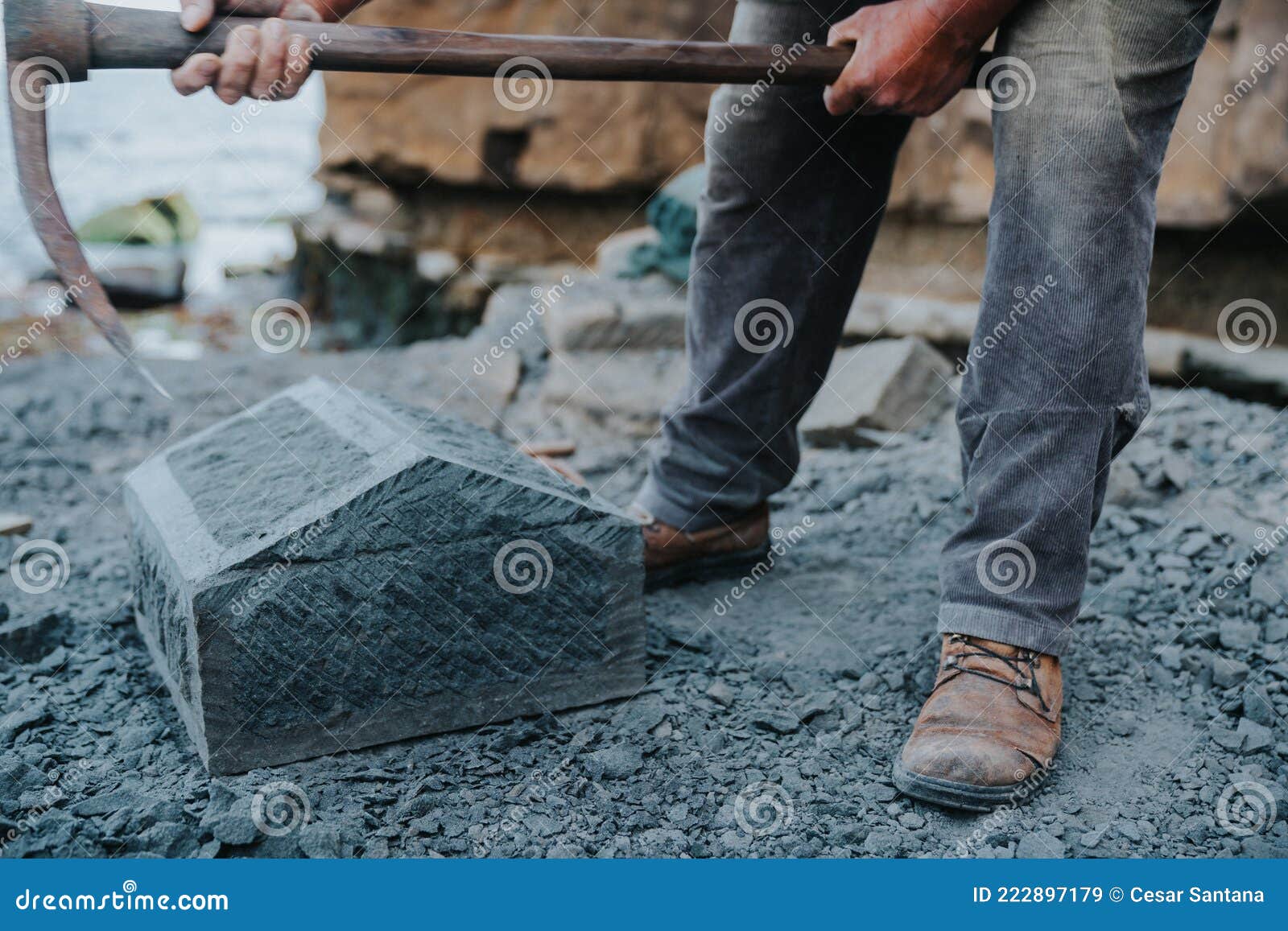 stone craftsman carefully chipping at a block of cancagua stone to  it