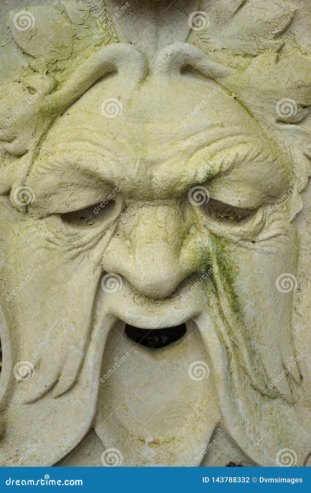 Stone Garden Face Ornament stock photo. Image of mask 143788332