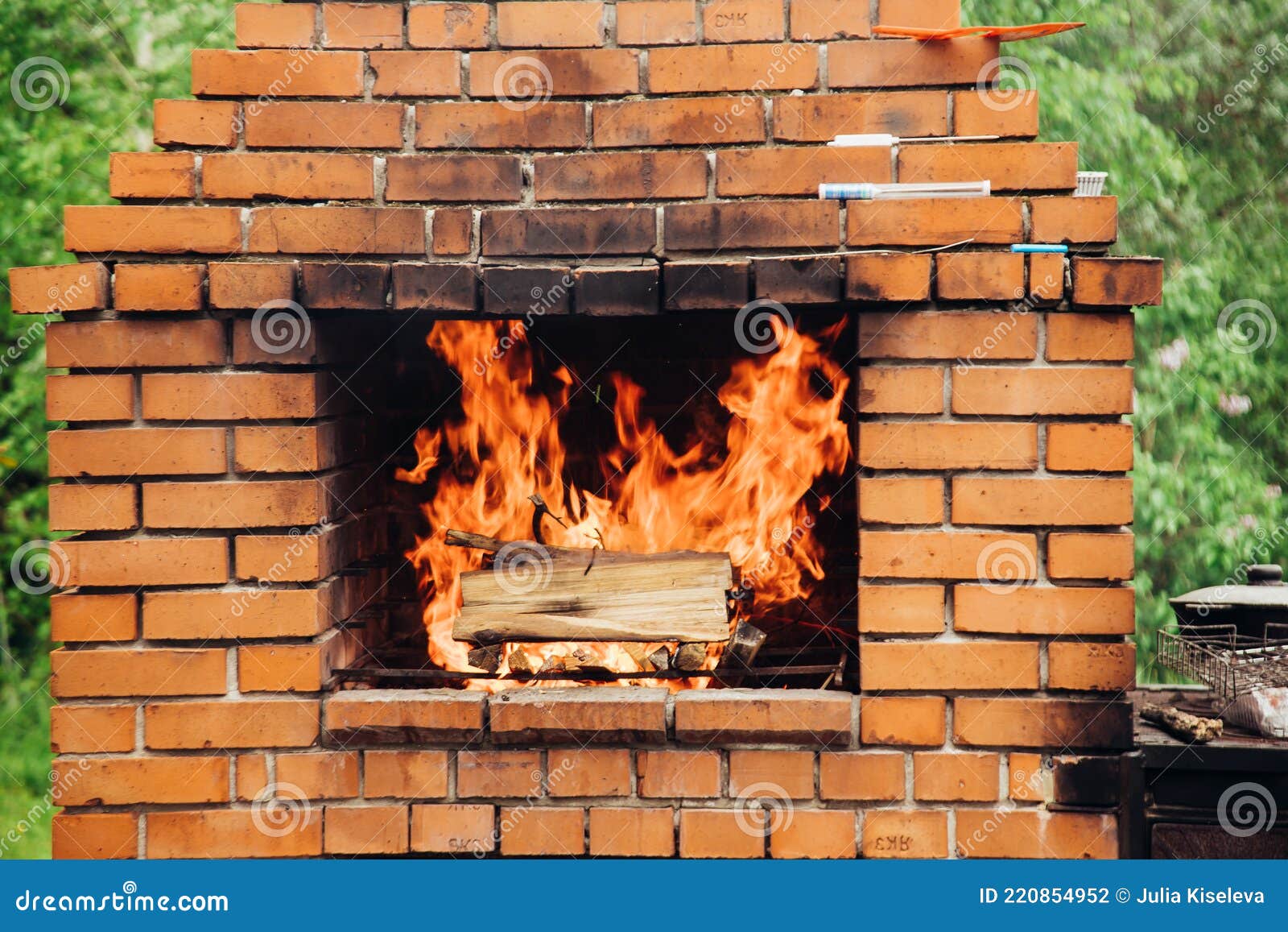 Stone Garden Oven for Grill or Barbeque is in a Backyard Stock Photo