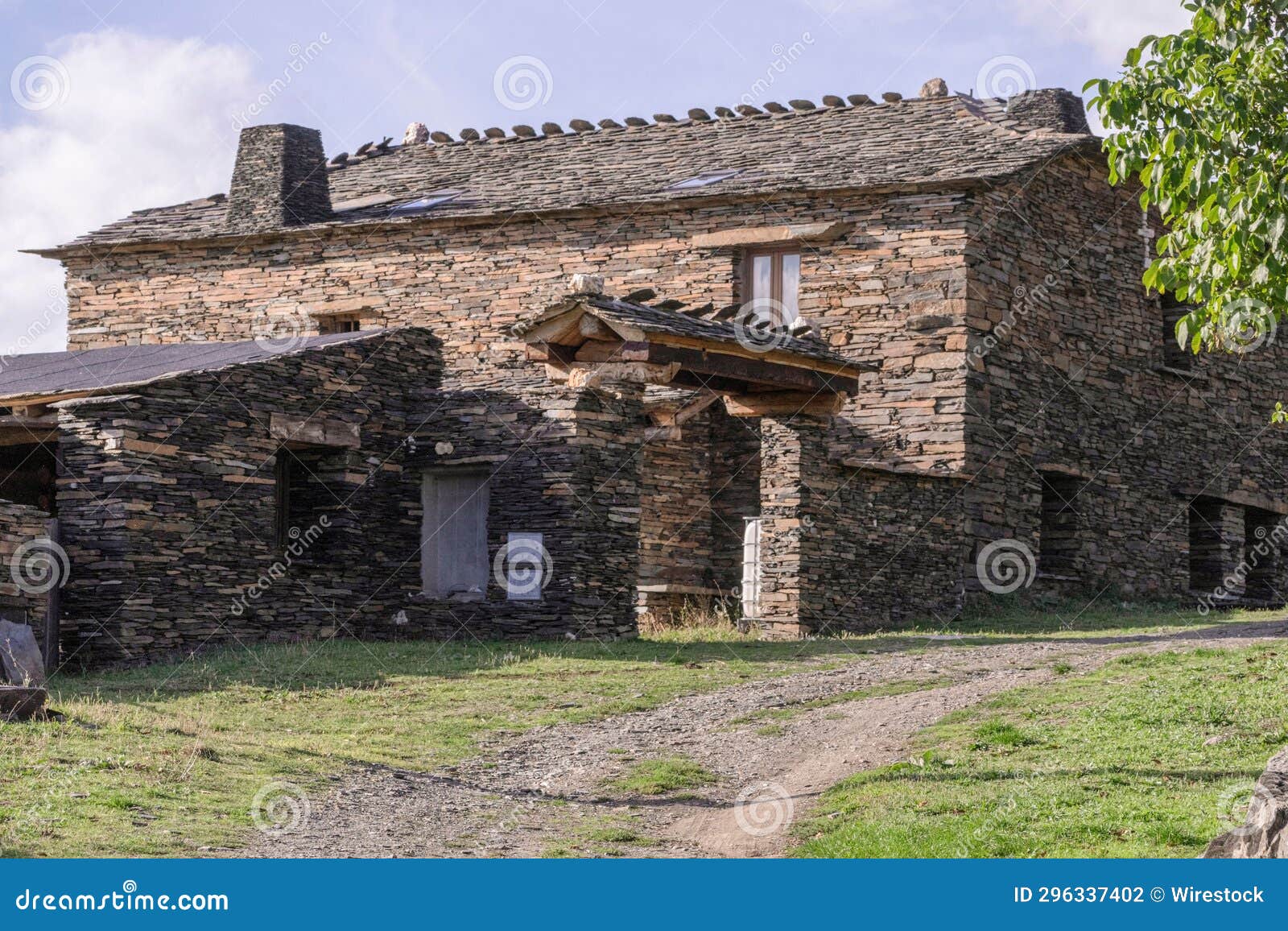 stone house in the middle of the countryside. typical house of the black tile villages