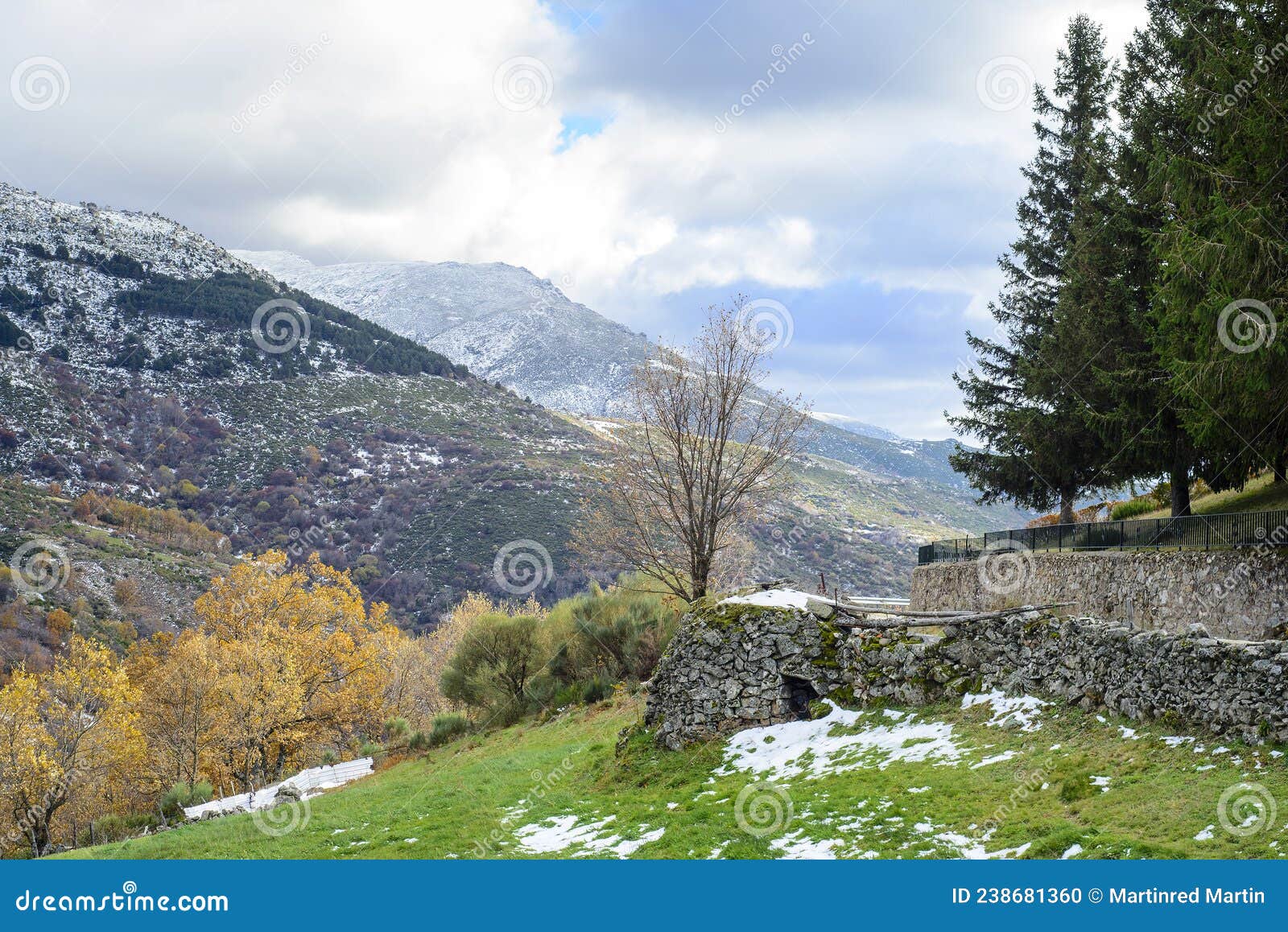 stone house and snowy mountain of hervas in autumn, extremadura