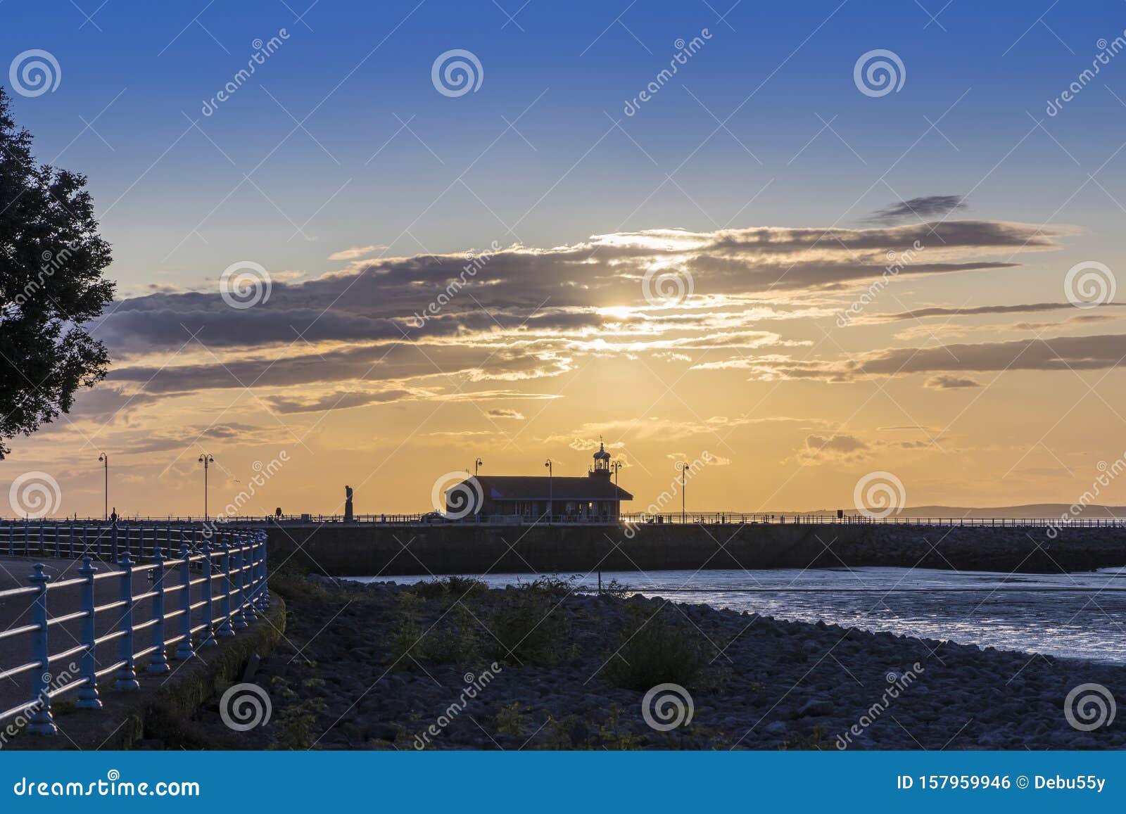 The Stone Jetty and Lighthouse in Morecambe at Dawn. Stock Photo