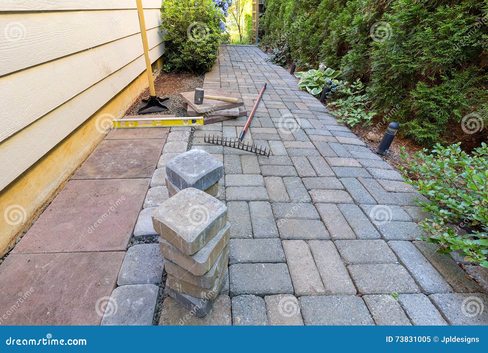 stone pavers and tools for side yard landscaping
