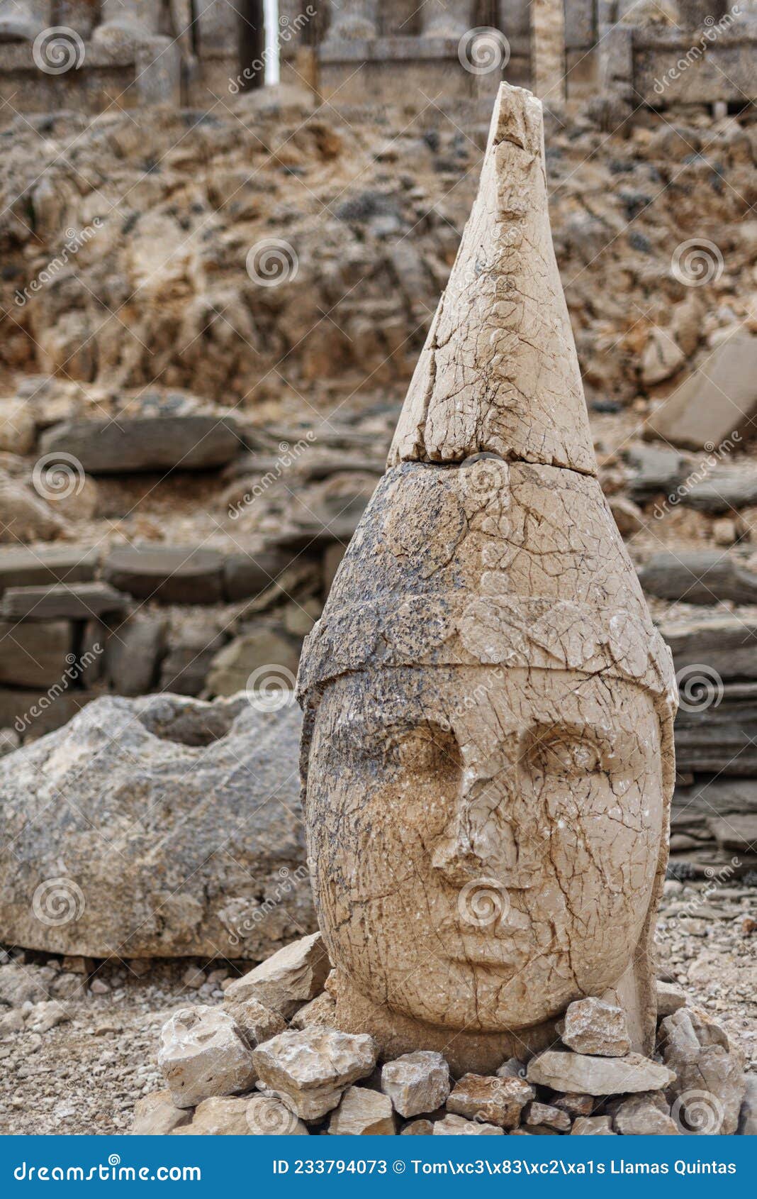 stone sculpture of a greek deity on the mountain