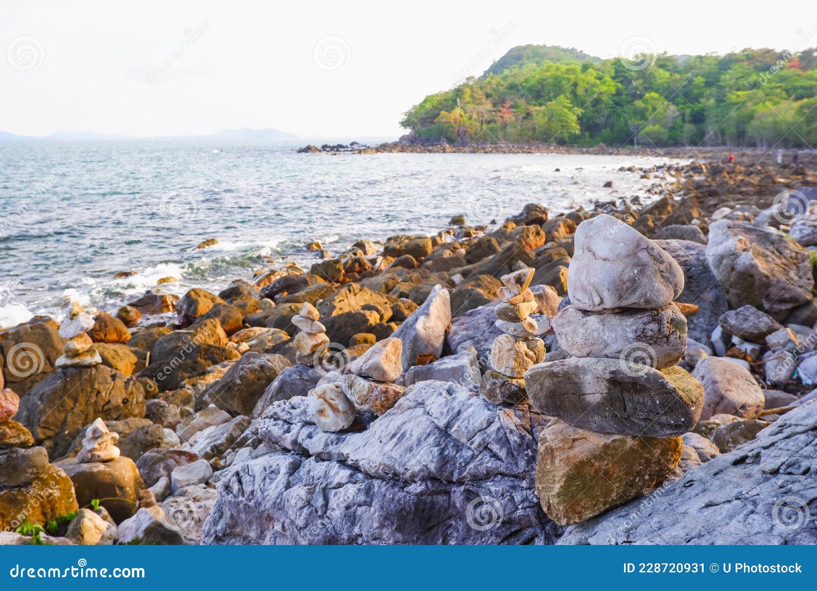 stone stacked on rock beach at laem hua mong - kho kwang viewpoint in chomphon province thailand