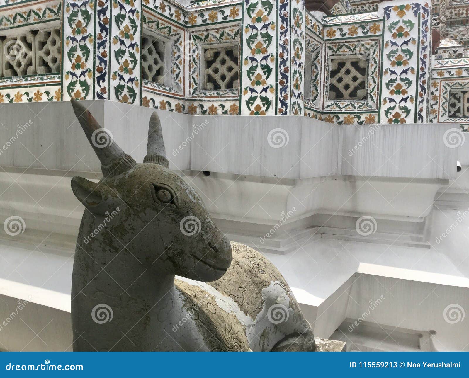stone statue of a goat at wat arun - temple of dawn