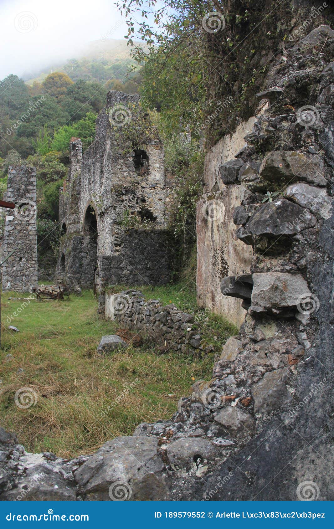 stone street, colorful houses and ruins of the la encarnacion foundry in zimapan hidalgo mexico