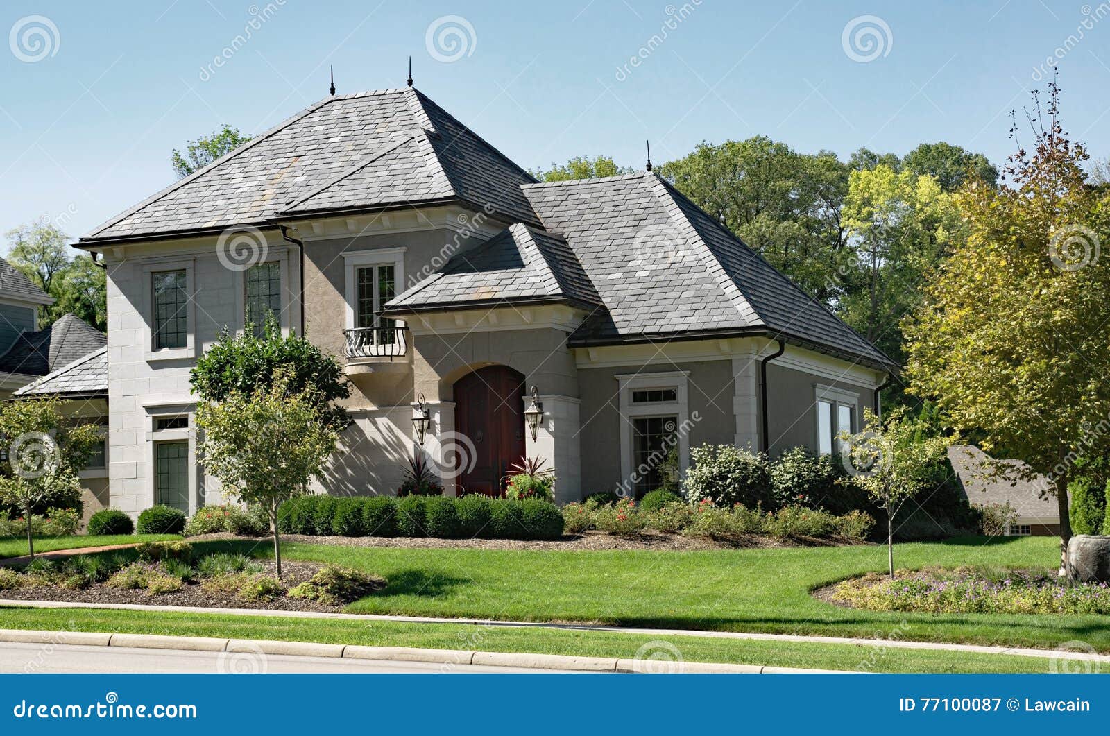 stone & stucco house with slate roof