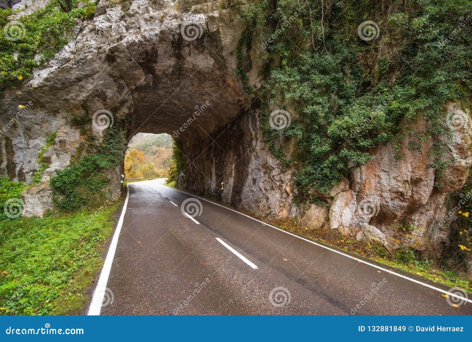 stone tunnel road in mountain scenary in somiedo natural park, asturias, spain