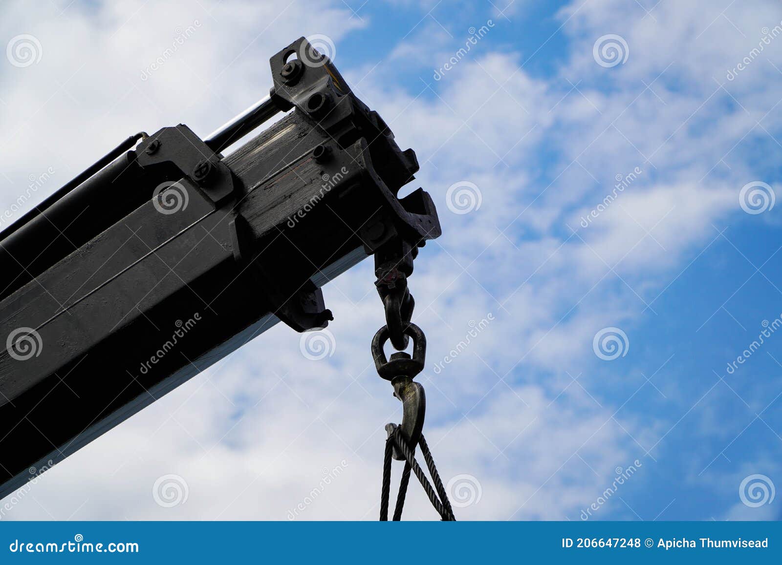 crane boom with  hook, blue sky background,s of crane: hook, loop, chain, connecting parts