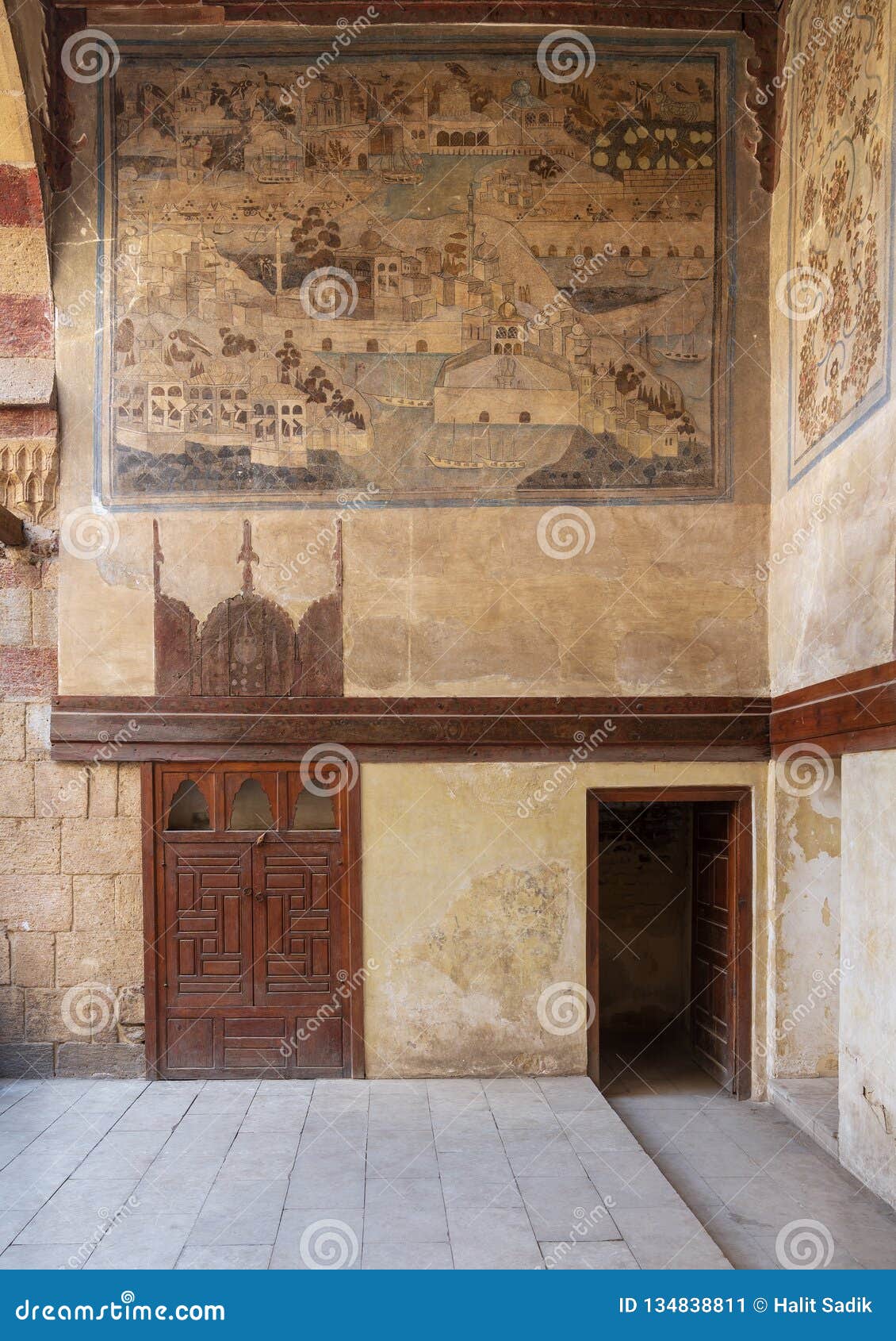 stone wall decorated with mural depicting istanbul city at ottoman historic waseela hanem house, old cairo, egypt