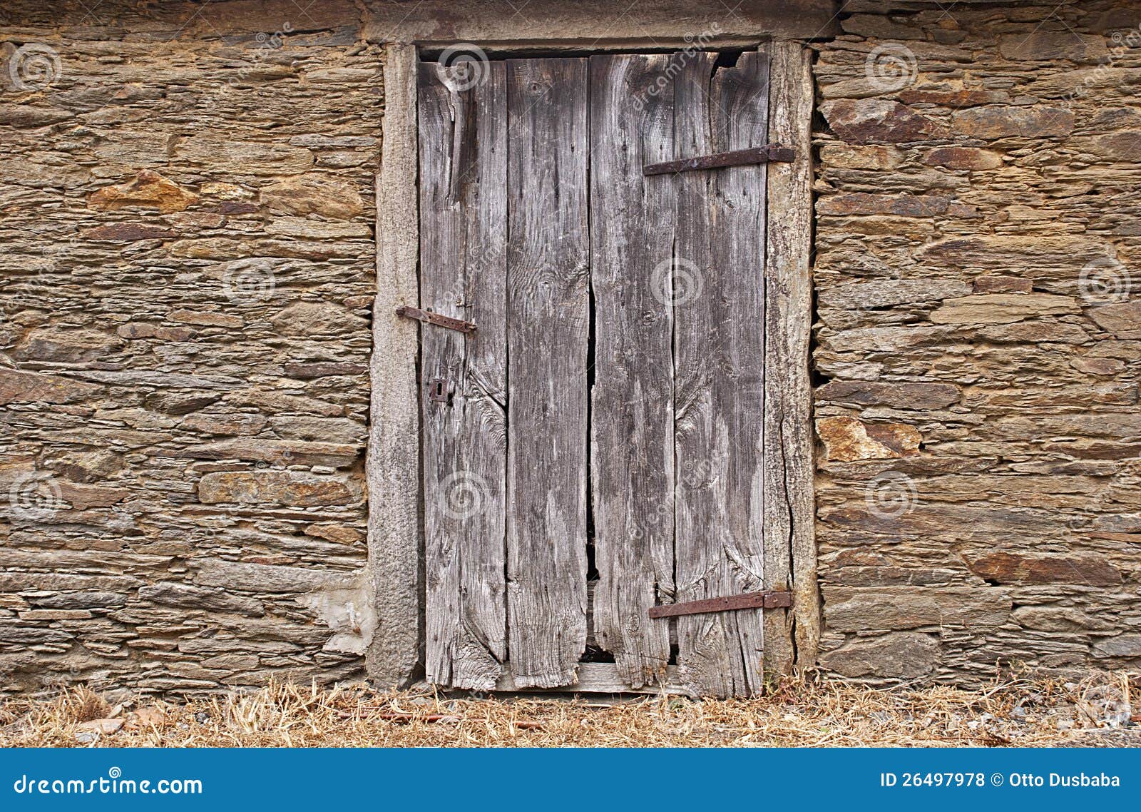 Stone wall with old door stock photo. Image of stones - 26497978