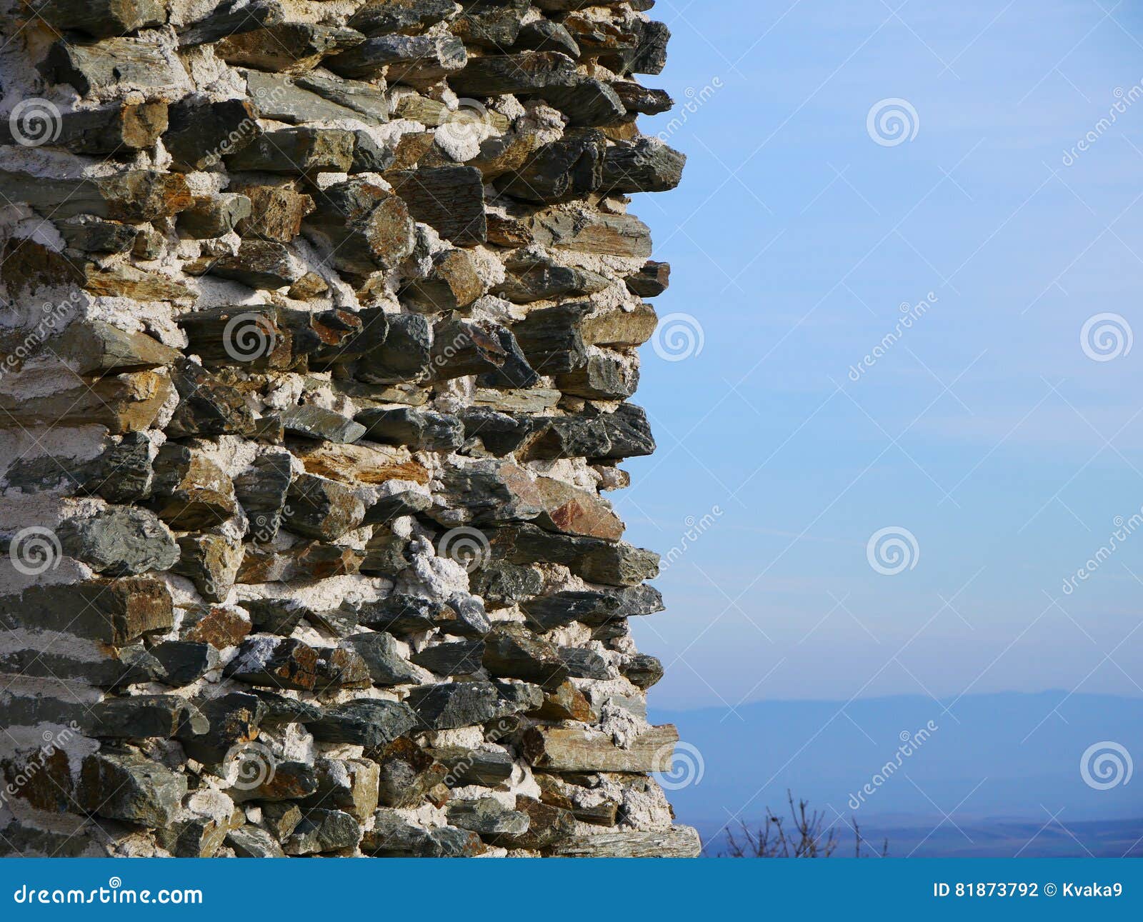 stone wall and carpathian mountains