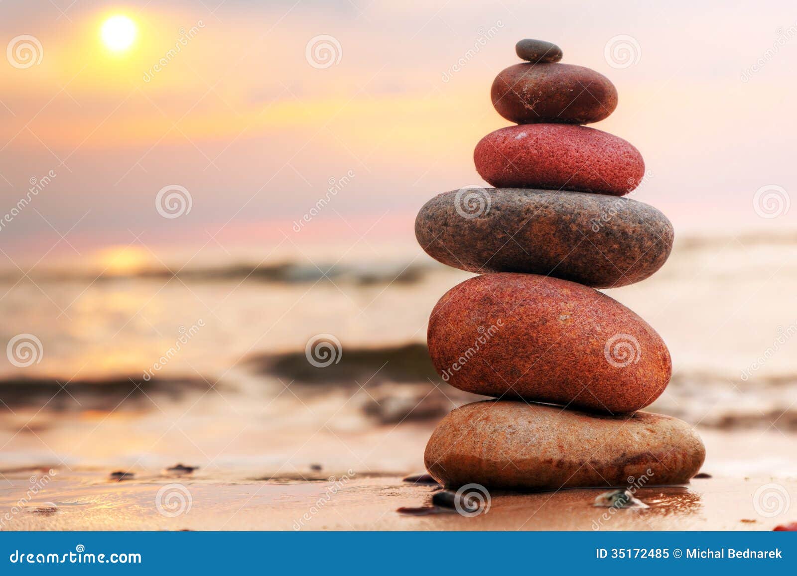 stones pyramid on sand izing harmony