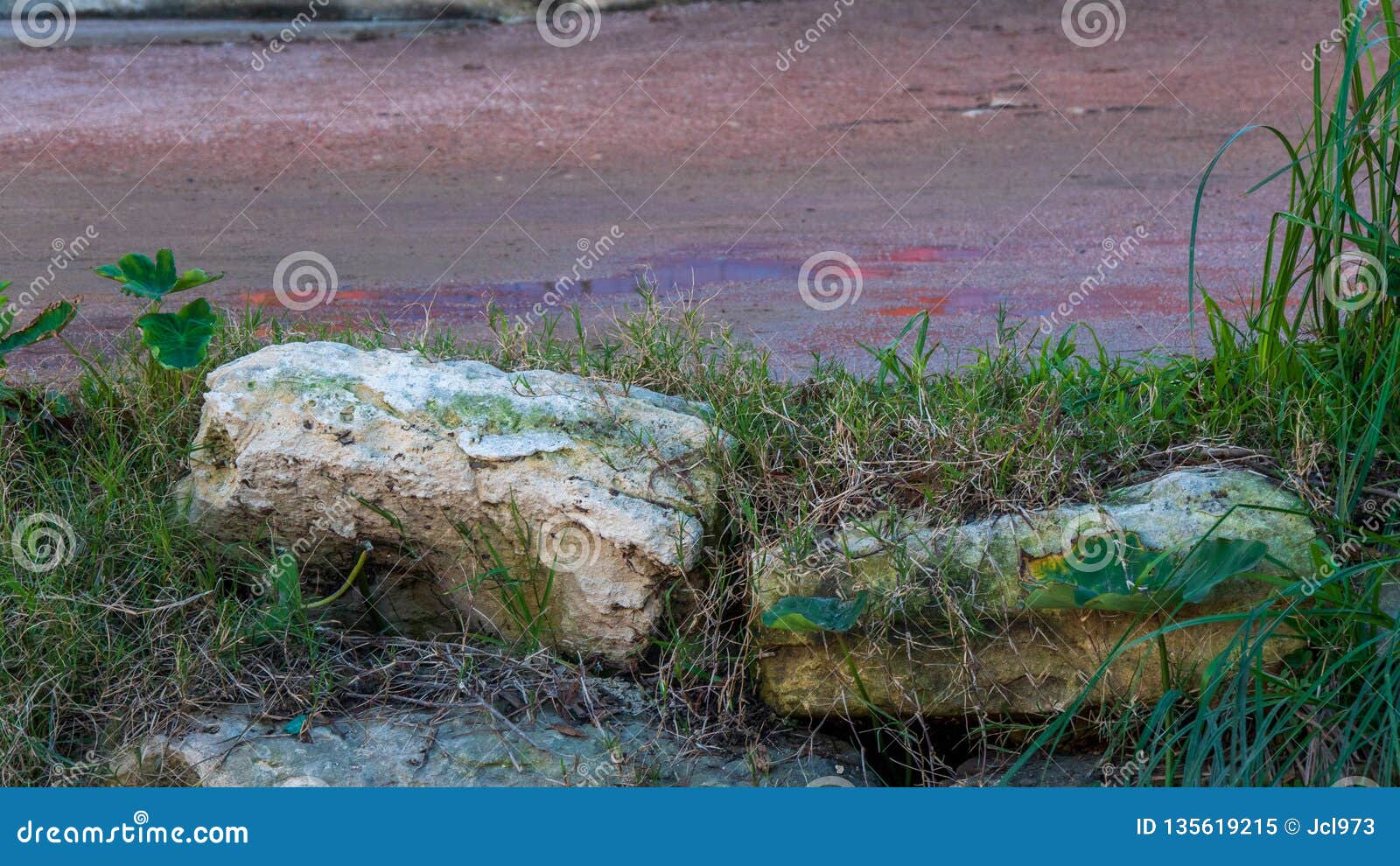 Stones on Top of the Bank of an Urban Segment of a River Stock Image