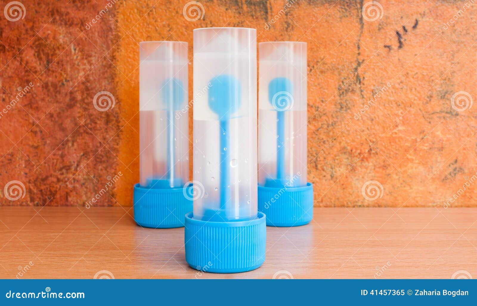 A Stool Sample Container For Fecal Tests In The Bathroom With A Roll Of Toilet Paper On The